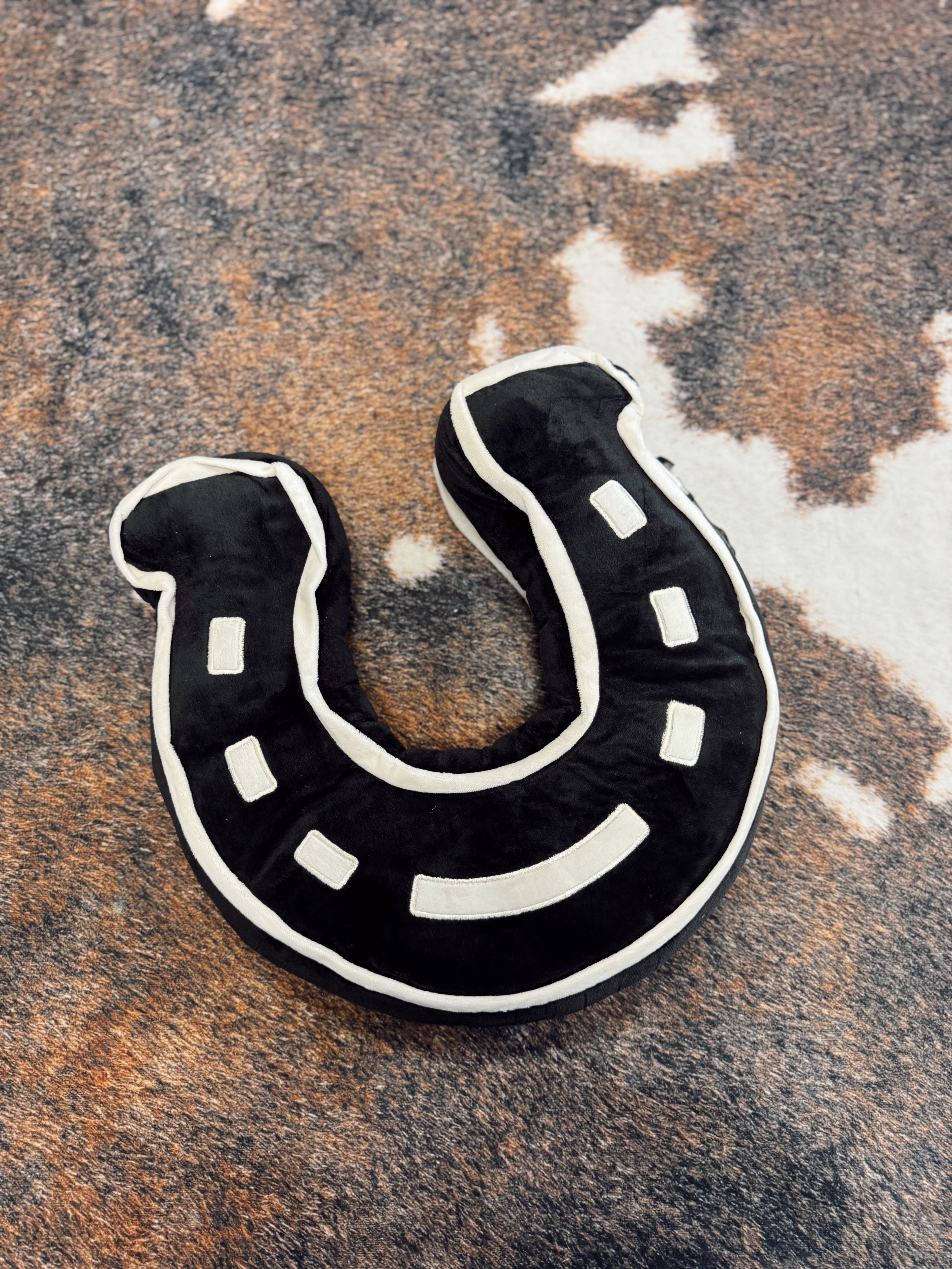 The Black Horseshoe Pillow